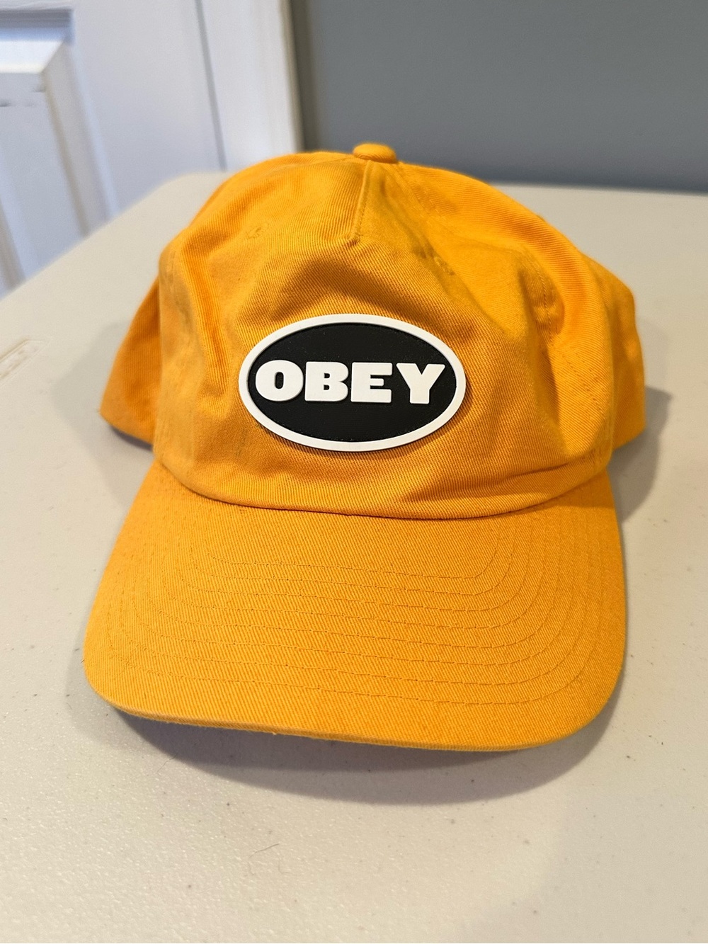 OBEY Oval 6 Panel Strapback Hat in Yellow